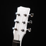 white colored 6 strings guitar-specification-acoustic. showcasing the saddle of the guitar